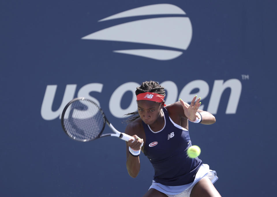 Coco Gauff, of the United States, returns a shot during a first round doubles match at the US Open tennis championships Friday, Aug. 30, 2019, in New York. (AP Photo/Kevin Hagen)