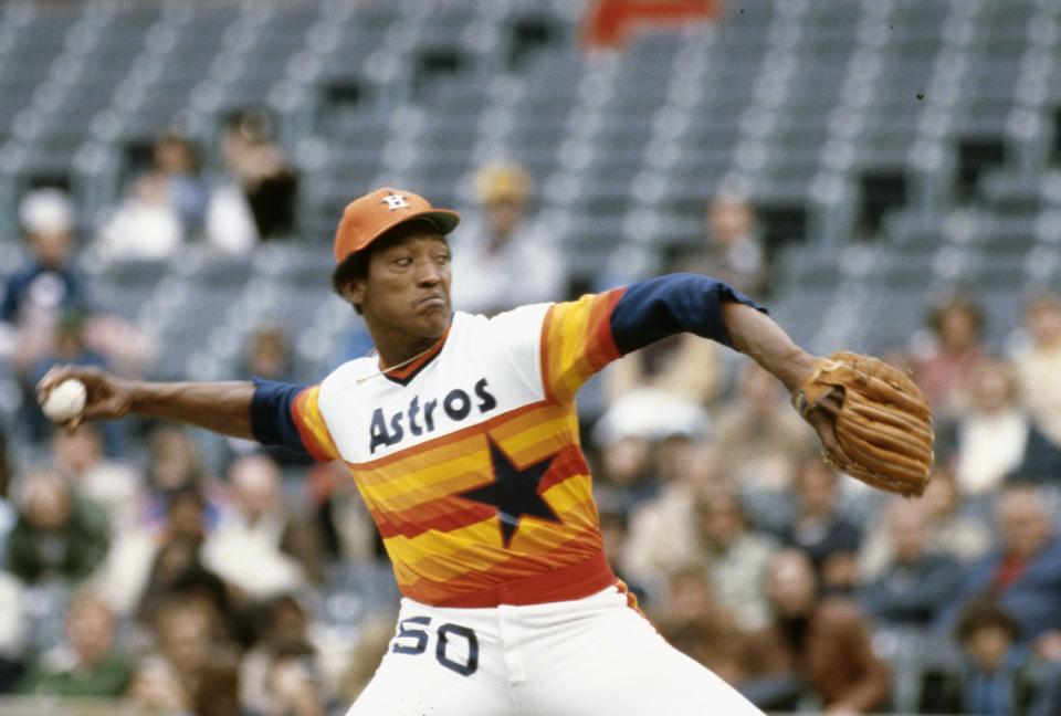 A person gets ready to throw a baseball.