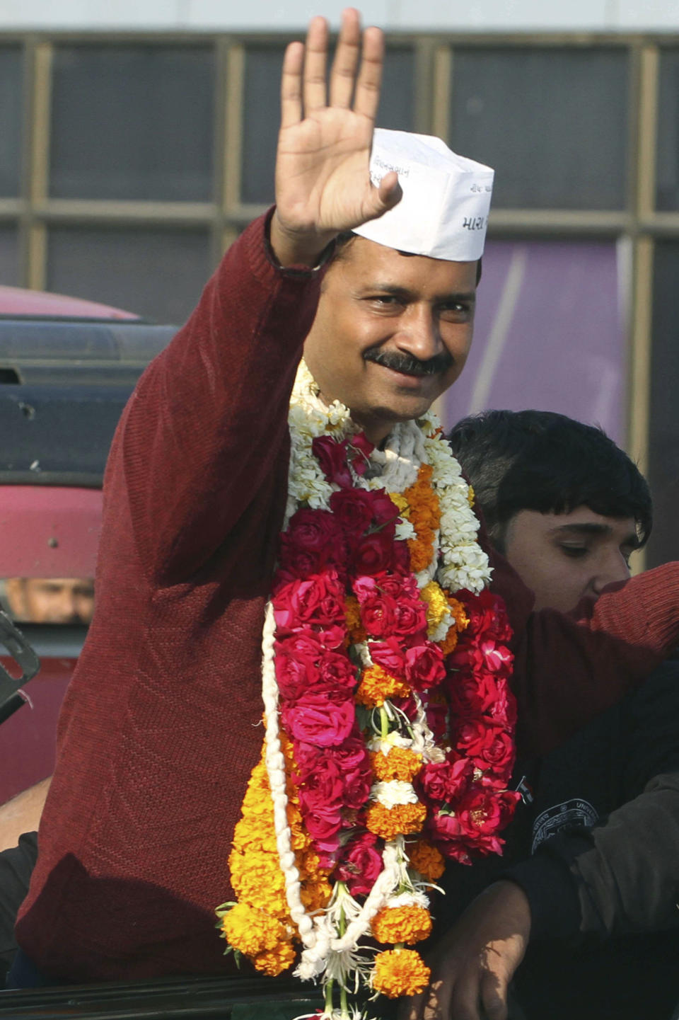 Anti-graft activist and leader of Aam Aadmi Party, or Common Man Party, Arvind Kejriwal waves to supporters upon his arrival for a four-day visit of Gujarat state ahead of the country’s national elections, in Ahmadabad, India, Wednesday, March 5, 2014. India said Wednesday it will begin national elections on April 7, kicking off a month-long contest in the largest democracy in the world. More than 810 million people are eligible to vote this year, an increase of 100 million from five years ago, according to the Election Commission. (AP Photo/Ajit Solanki)