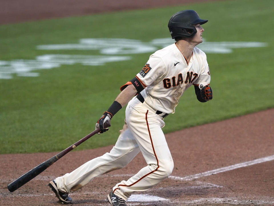 San Francisco Giants' Mike Yastrzemski hits a single to drive in a run against the Arizona Diamondbacks during the sixth inning of a baseball game on Monday, Sept. 7, 2020, in San Francisco. (AP Photo/Tony Avelar)