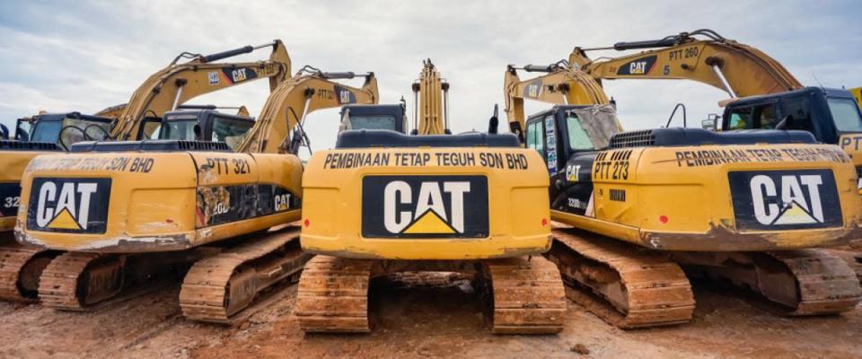 Modern hydraulic excavator on a field work site where an excavation works is performed in Kuala Lumpur, Malaysia.