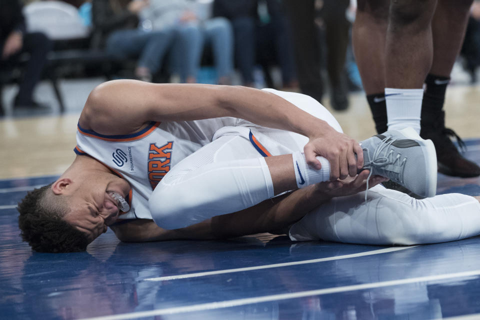 New York Knicks forward Kevin Knox reacts after injuring himself during the first half of an NBA basketball game against the Boston Celtics, Saturday, Oct. 20, 2018, at Madison Square Garden in New York. (AP Photo/Mary Altaffer)