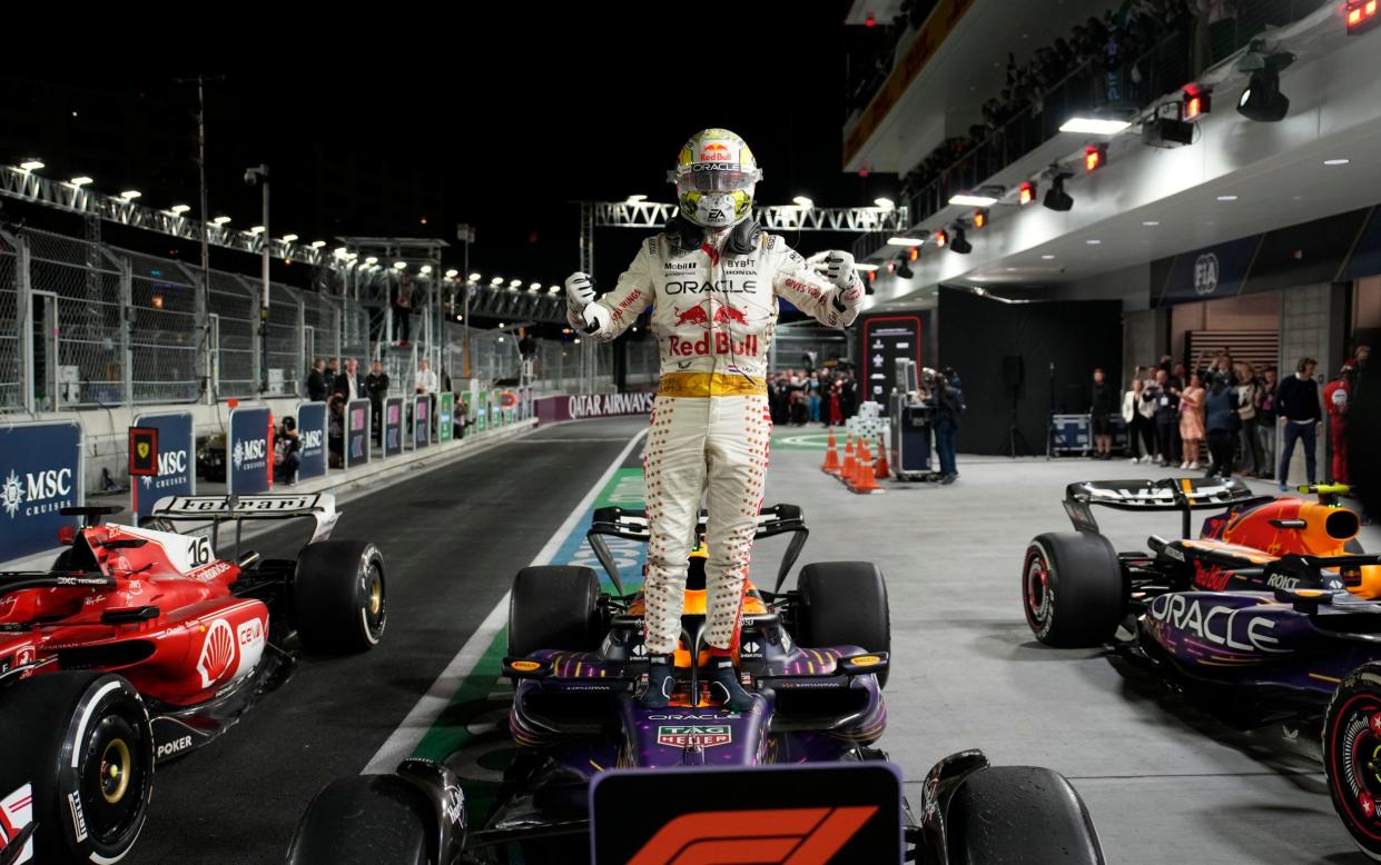 Red Bull driver Max Verstappen, of the Netherlands, stands on top of his car after winning the Formula One Las Vegas Grand Prix auto race, Saturday, Nov. 18, 2023, in Las Vegas