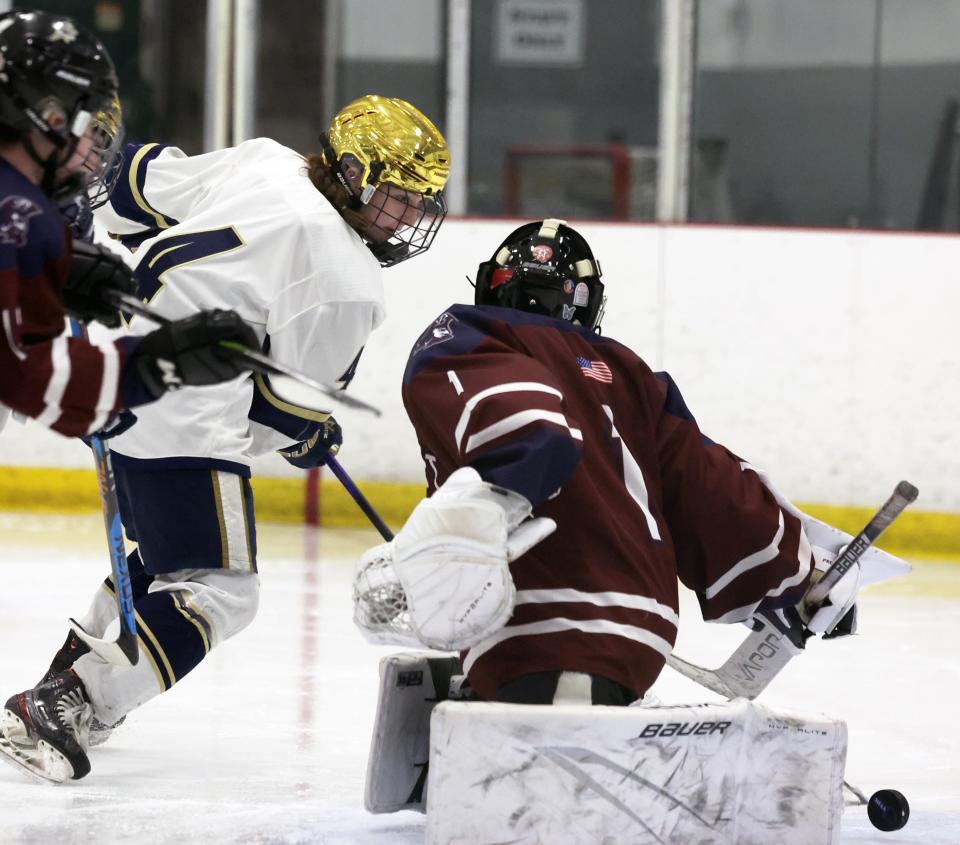 Archbishop Williams Shea Nolan scores a goal on Belmont's Jil Costa during a game on Thursday, March 7, 2024.