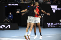 Nick Kyrgios, right, and Thanasi Kokkinakis of Australia celebrate after defeating compatriots Matthew Ebden and Max Purcell in the men's doubles final at the Australian Open tennis championships in Saturday, Jan. 29, 2022, in Melbourne, Australia. (AP Photo/Andy Brownbill)