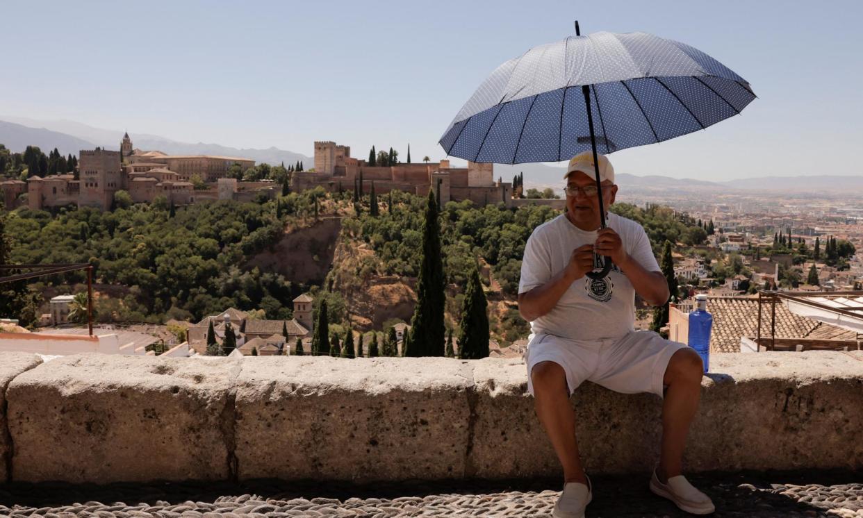 <span>Tourists visiting popular Spanish sites such as the Alhambra are advised to follow the cues of local people in how to stay cool.</span><span>Photograph: Jon Nazca/Reuters</span>