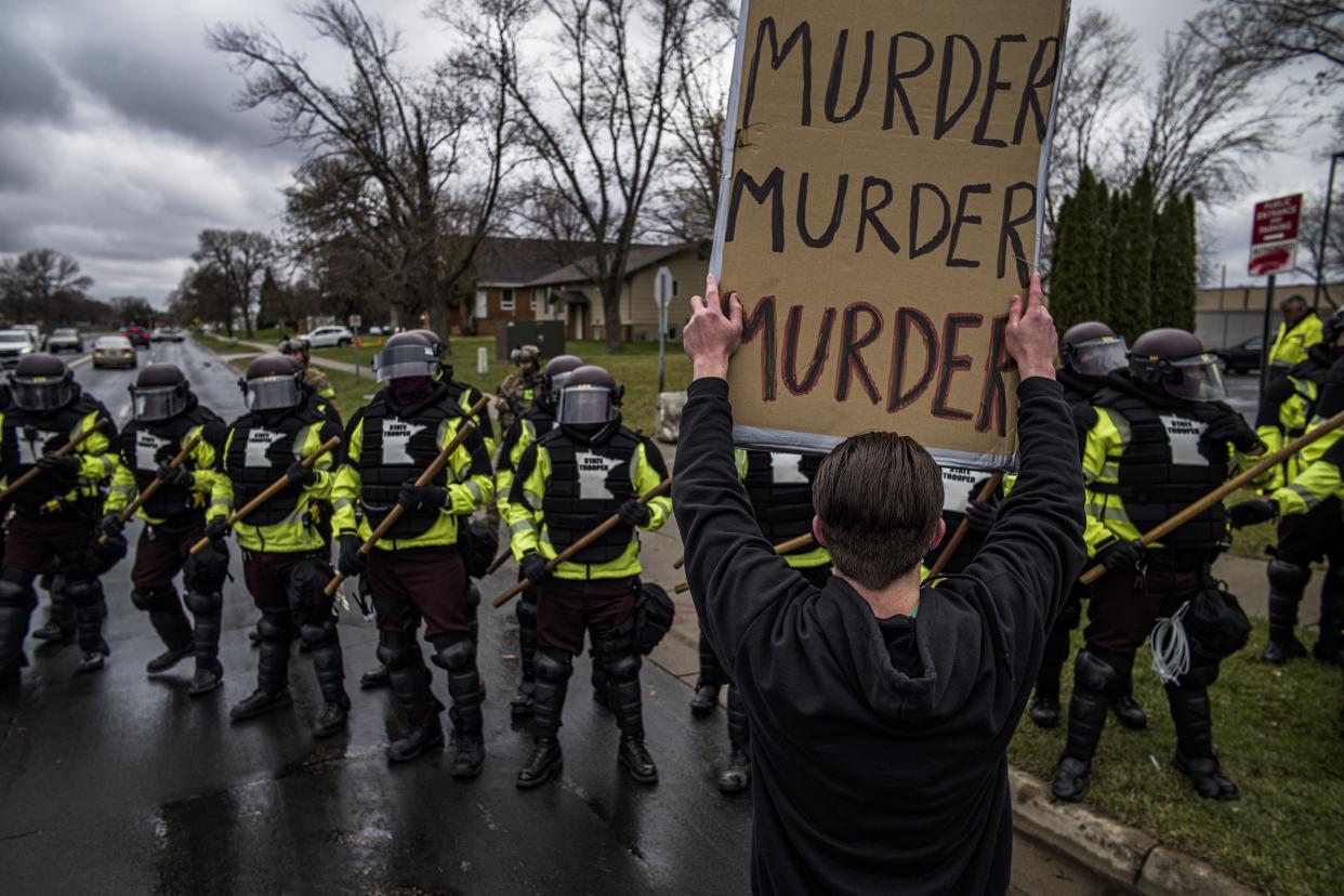 Protesters confront police over the shooting death of Daunte Wright at a rally at the Brooklyn Center Police Department in Brooklyn Center, Minn., Monday, April 12, 20121.