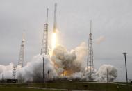 A rocket carrying the SpaceX Dragon ship lifts off from launch complex 40 at the Cape Canaveral Air Force Station in Cape Canaveral, Fla. on Friday, April 18, 2014. The mission will deliver research equipment, food and other supplies to the International Space Station. (AP Photo/John Raoux)