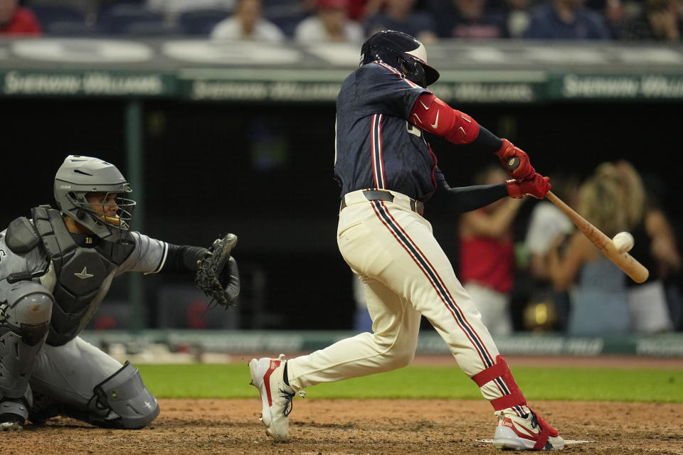 Cleveland Guardians' Bo Naylor hits a sacrifice fly to score Andres Gimenez in the ninth inning to defeat the Chicago White Sox in a baseball game Tuesday, July 2, 2024, in Cleveland. (AP Photo/Sue Ogrocki)