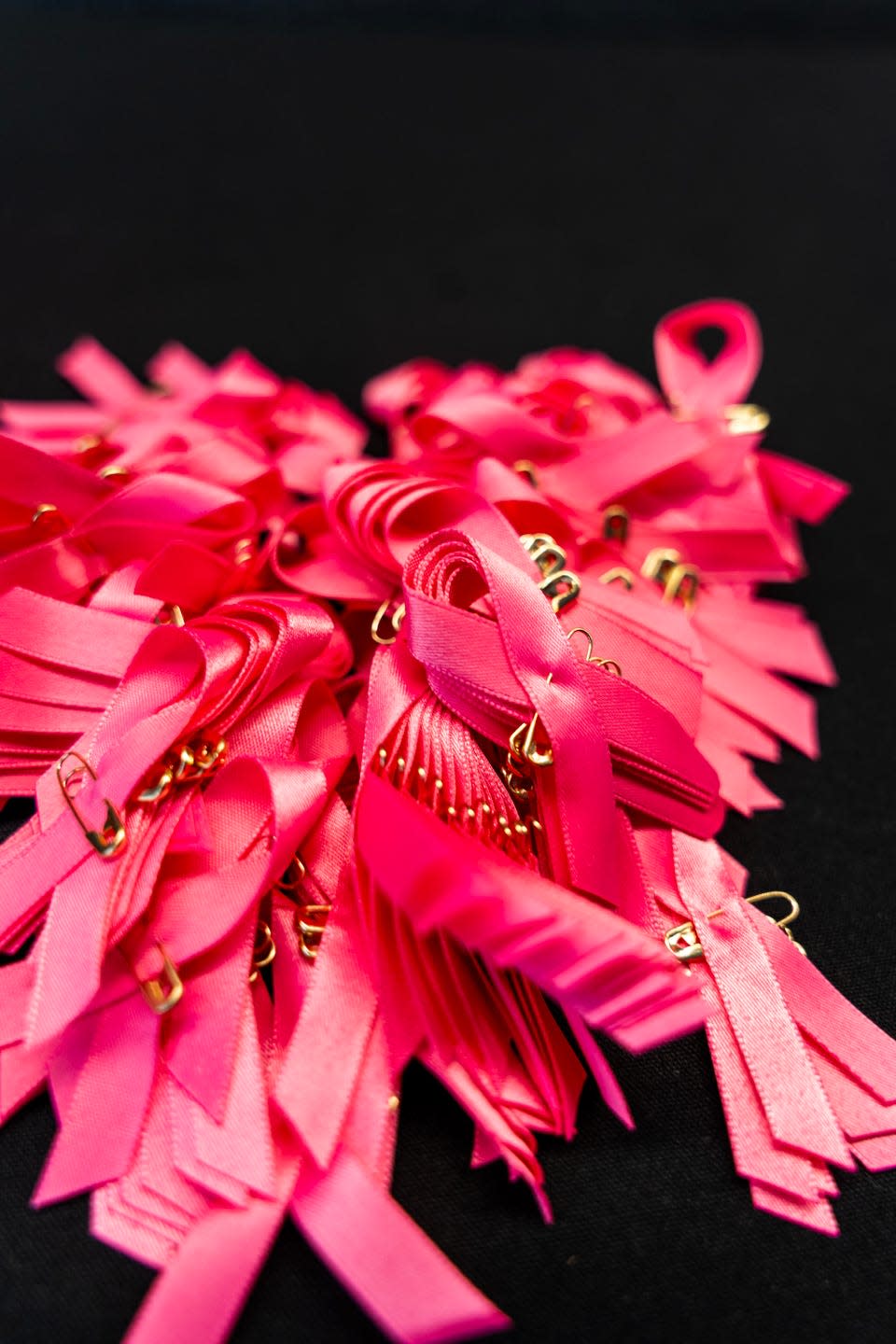 a pile of breast cancer ribbons