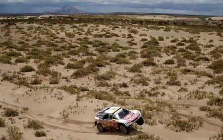 Dakar Rally - 2017 Paraguay-Bolivia-Argentina Dakar rally - 39th Dakar Edition - Fifth stage from Tupiza to Oruro, Bolivia 06/01/17. Stephane Peterhansel of France drives his Peugeot with his copilot Jean Paul Ottret. REUTERS/Ricardo Moraes