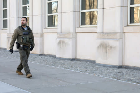 A member of the U.S. Marshall service patrols outside the Brooklyn Federal Courthouse, during he trial of Joaquin Guzman, the Mexican drug lord known as "El Chapo", in the Brooklyn borough of New York, U.S., February 6, 2019. REUTERS/Brendan McDermid