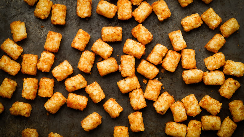 Tater tots spread on surface