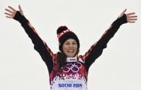 Canada's second placed Kelsey Serwa celebrates after the women's freestyle skiing skicross finals at the 2014 Sochi Winter Olympic Games in Rosa Khutor, February 21, 2014. REUTERS/Dylan Martinez (RUSSIA - Tags: SPORT SKIING OLYMPICS)