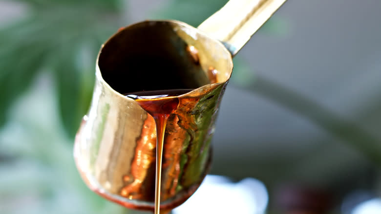 Syrup pouring from jug