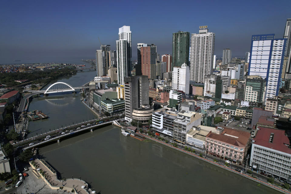 Aerial view showing William A. Jones Memorial Bridge, front, and Binondo-Intramuros bridge connects Binondo district, said to be the oldest Chinatown in the world, on Wednesday, Feb. 7, 2024 in Manila, Philippines. Crowds are flocking to Manila's Chinatown to usher in the Year of the Wood Dragon and experience lively traditional dances on lantern-lit streets with food, lucky charms and prayers for good fortune. (AP Photo/Aaron Favila)