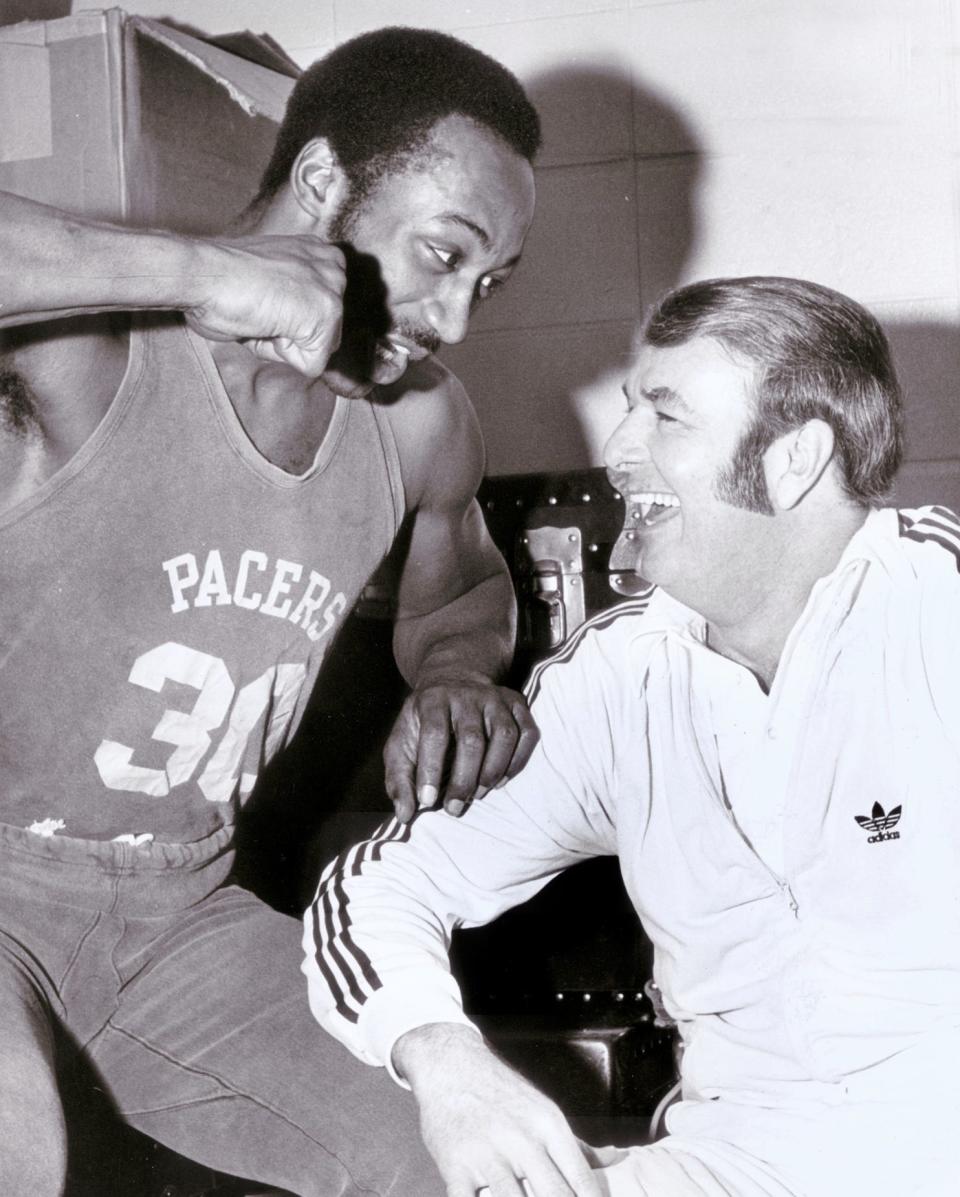 George McGinnis (30) playfully taunts Pacers coach Bobby Leonard in 1975.   