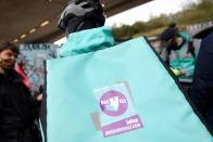 Deliveroo riders demonstrate to push for improved working conditions, in London