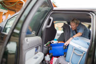 Ruth Hugill repacks her vehicle as she prepares to leave Christina Lake Lodge after evacuating from Fort McMurray due to raging wildfires in Conklin, Alberta, May 5, 2016. REUTERS/Topher Seguin