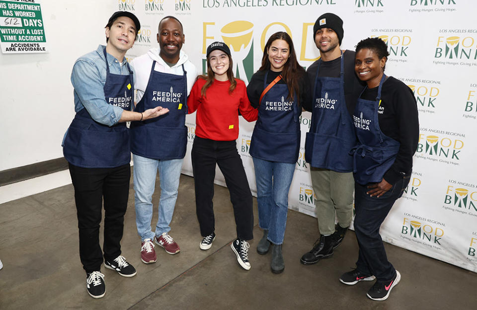 (L-R) Justin Long, Lamorne Morris, Zoey Deutch, Lorenza Izzo, Mason Gooding and Adina Porter attend the Feeding America Hosts Volunteer Event at Los Angeles Regional Food Bank on April 07, 2023 in Los Angeles, California.