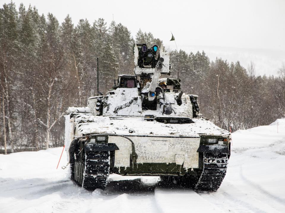 A Norwegian Combat Vehicle 90 moves towards an objective during a combined level brigade attack in Setermoen, Norway, April 27, 2022.