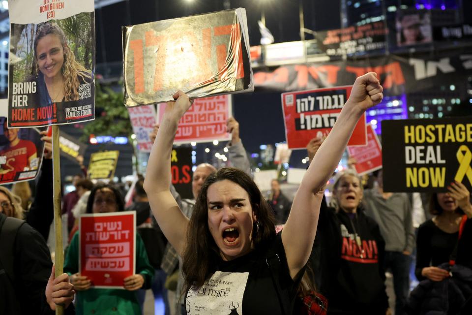 Relatives and supporters of Israeli hostages held in Gaza since the October 7 attacks by Hamas militants, hold placards during a demonstration in Tel Aviv, on March 26, 2024.