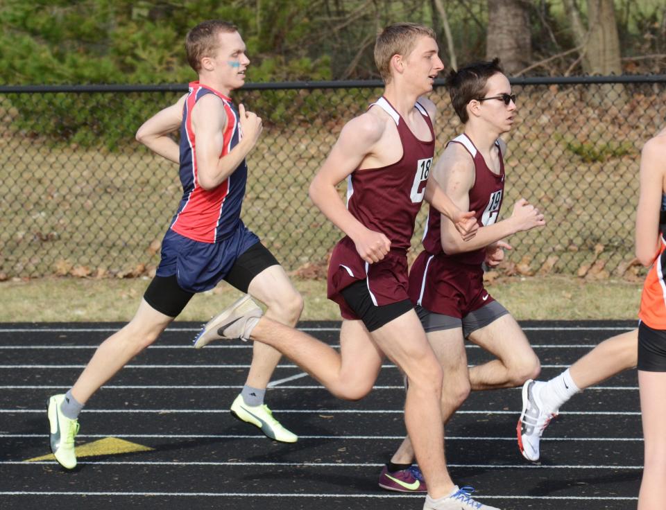 Charlevoix's James Descamps and David Dhaseleer, along with Boyne City's Joe Heckroth, run during the 1600 meter race Friday at the Ram Scram