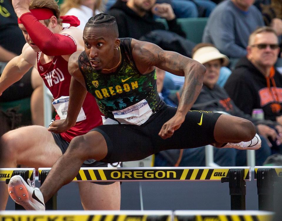 Oregon's Will Mundy competes in the preliminary round of the men's 100-meter hurdles at the Pac-12 Track & Field Championships at Hayward Field in Eugene, Ore. Saturday, ay 14, 2022.