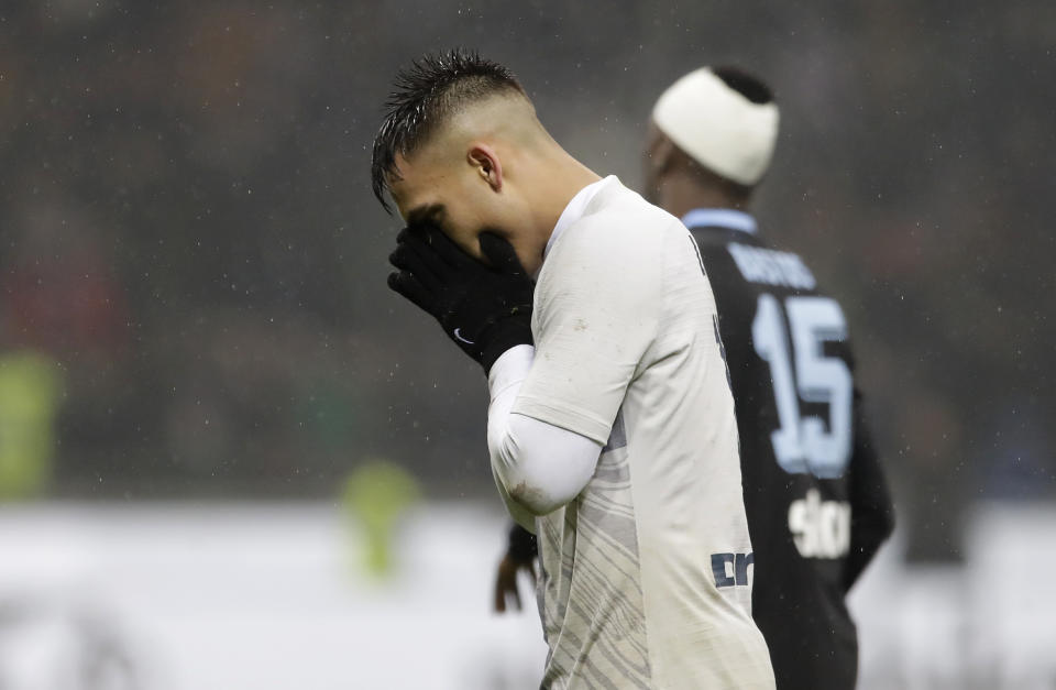 Inter Milan's Lautaro Martinez reacts after missing a scoring chance during an Italian Cup quarterfinal soccer match between Inter Milan and Lazio at the San Siro stadium, in Milan, Italy, Thursday, Jan. 31, 2019. (AP Photo/Luca Bruno)