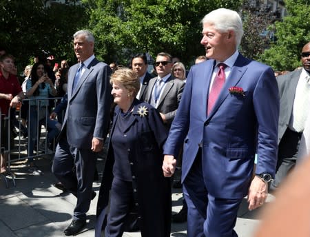 Former U.S. President Bill Clinton, Madeleine Albright, and President of Kosovo Hashim Thaci, walk during the 20th anniversary of the Deployment of NATO Troops in Kosovo in Pristina