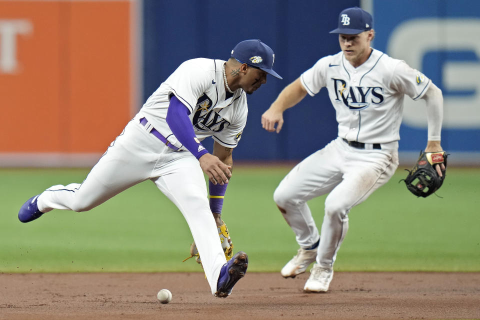 Tampa Bay Rays shortstop Wander Franco, left, and second baseman Taylor Walls attempt to pick up a fielder's choice by Minnesota Twins' Jorge Polanco during the first inning of a baseball game Thursday, June 8, 2023, in St. Petersburg, Fla. (AP Photo/Chris O'Meara)