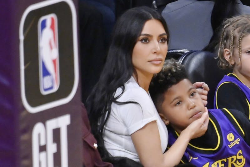 Kim Kardashian (L) and son Saint West attend a Los Angeles Lakers and Golden State Warriors basketball game in March. File Photo by Jim Ruymen/UPI