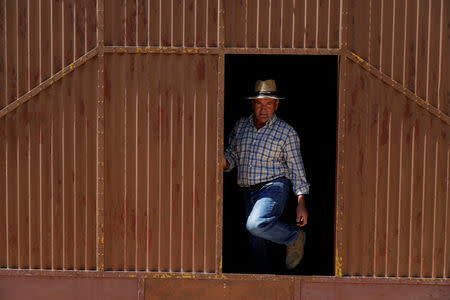 Carmona, owner of a small farm, leaves his shed where he keeps tools and tractors, near Pias, Portugal, August 9, 2018. REUTERS/Rafael Marchante