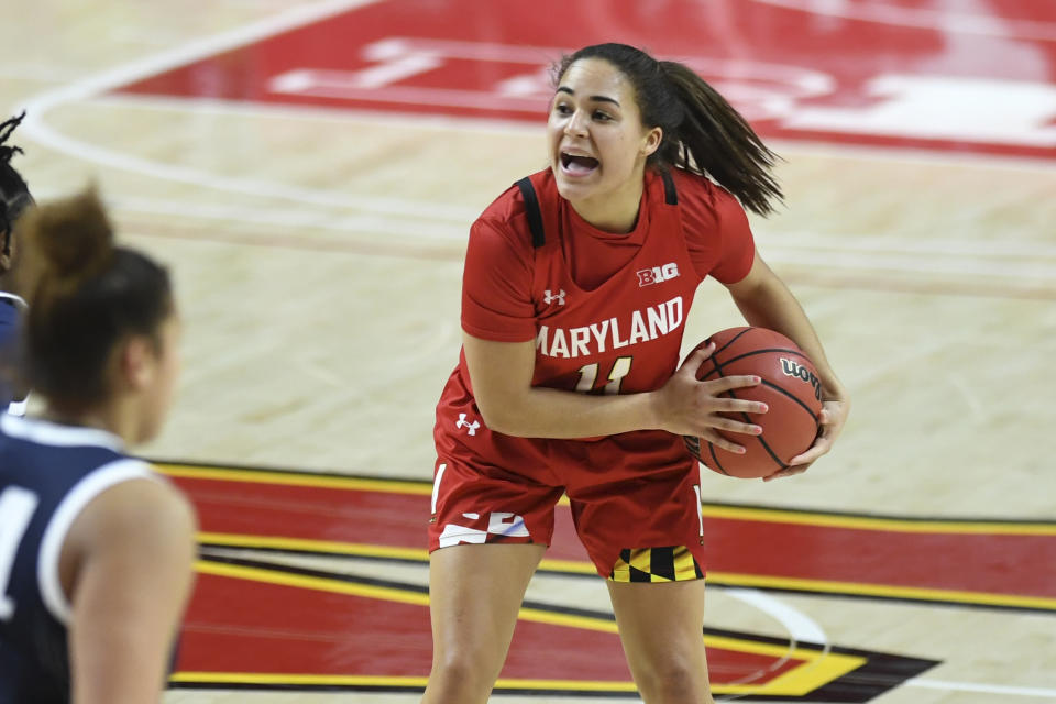 FILE - Maryland guard Katie Benzan (11) handles the ball during the second half of an NCAA college basketball game against Penn State Saturday, March 6, 2021, in College Park, Md. No. 4 Maryland is the Big Ten’s top-ranked women’s basketball team. (AP Photo/Terrance Williams, File)