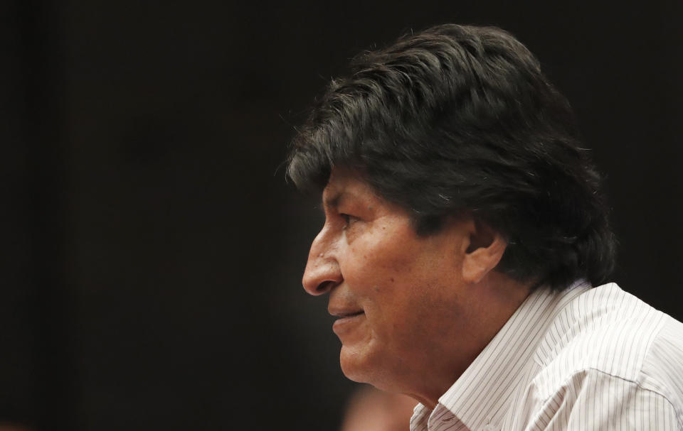 Bolivia's former President Evo Morales takes part in a press conference at the Museum of Mexico City, Wednesday, Nov. 13, 2019. Mexico has granted asylum to Morales, who resigned on Nov. 10th under mounting pressure from the military and the public after his re-election victory triggered weeks of fraud allegations and deadly protests. (AP Photo/Marco Ugarte)