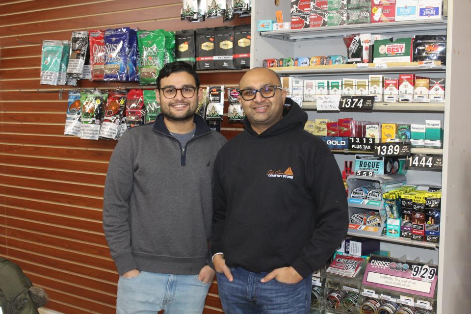 Gokul Shah, left, and Ankur Purani, right, have begun making updates and adding inventory at the Scio Country Store at 3983 Main St.
