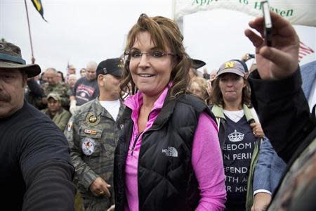 Former Alaska Governor Sarah Palin arrives at the "Million Vet March on the Memorials" at the U.S. National World War II Memorial in Washington October 13, 2013. REUTERS/Joshua Roberts