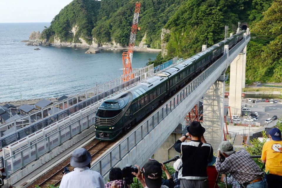 Japan's Twilight Express Mizukaze train crosses the Amarube Bridge