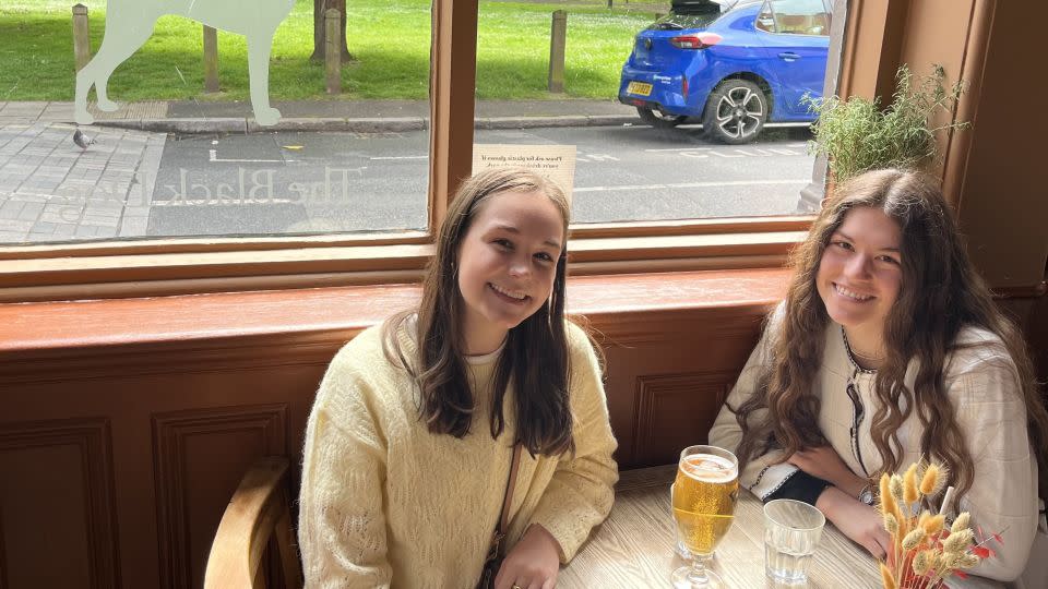 Taylor Swift fans Jenna Spackey and Maddie Essig came to check out The Black Dog pub after listening to the song. - Francesca Street/CNN