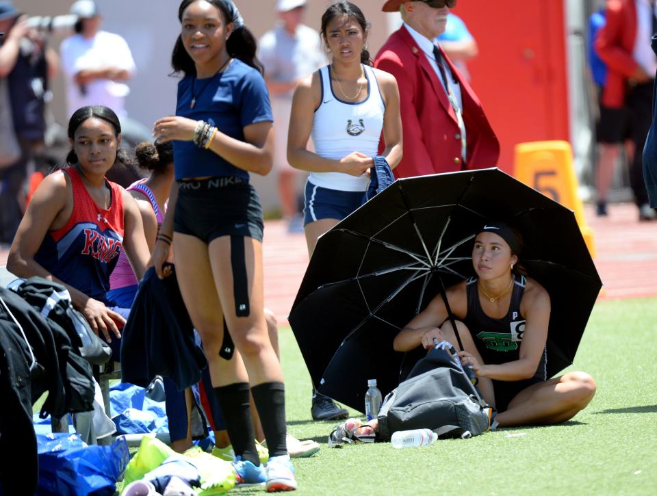 Thousand Oaks High's Lauren Thai tries to stay cool while waiting to compete in the Division 2 long jump at the CIF-Southern Section Track and Field Championships at Moorpark High on Saturday, May 14, 2022. Thai finished fifth in the event while winning the 100 and 300 hurdles.