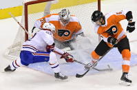Philadelphia Flyers goaltender Carter Hart (79) makes a save on Montreal Canadiens' Artturi Lehkonen (62) as Flyers' Philippe Myers (5) defends during the second period of an NHL Eastern Conference Stanley Cup hockey playoff game in Toronto, Wednesday, Aug. 12, 2020. (Frank Gunn/The Canadian Press via AP)