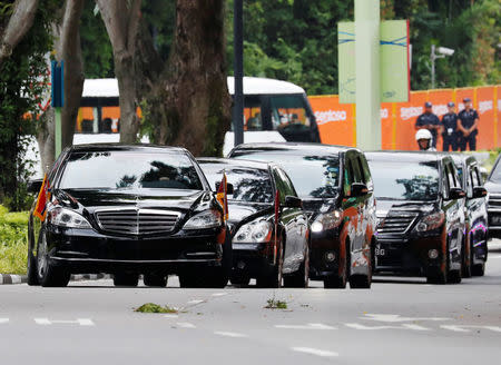 The motorcade of North Korea's leader Kim Jong Un arrives at the Capella hotel, the venue of the summit between North Korea and the U.S., on Sentosa island in Singapore June 12, 2018. REUTERS/Kim Kyung-hoon