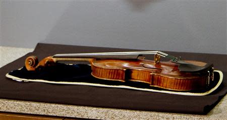 The 300-year-old Stradivarius violin that was taken from the Milwaukee Symphony Orchestra's concertmaster in an armed robbery is on display for the media after it was recently recovered, in Milwaukee, Wisconsin February 6, 2014. REUTERS/Darren Hauck