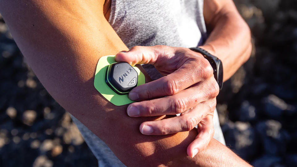 Person interacting with the Nix Biosensor on their arm