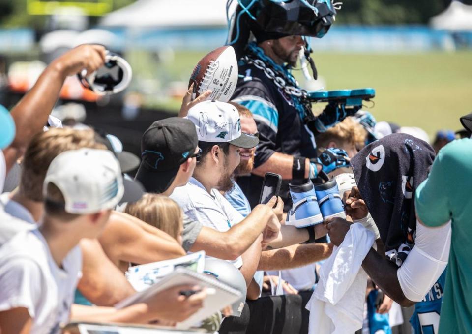 Carolina Panthers Brian Burns signs autographs for fans after Panthers Training Camp at Wofford College in Spartanburg, N.C., on Wednesday, July 26, 2023.