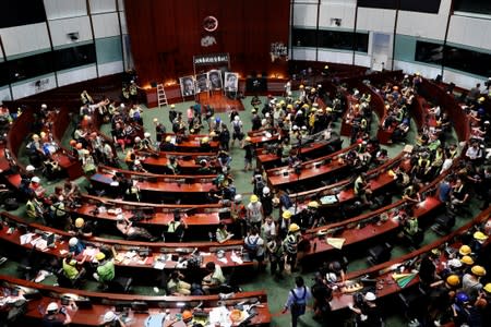 People are seen inside a chamber, after protesters broke into the Legislative Council building during the anniversary of Hong Kong's handover to China in Hong Kong