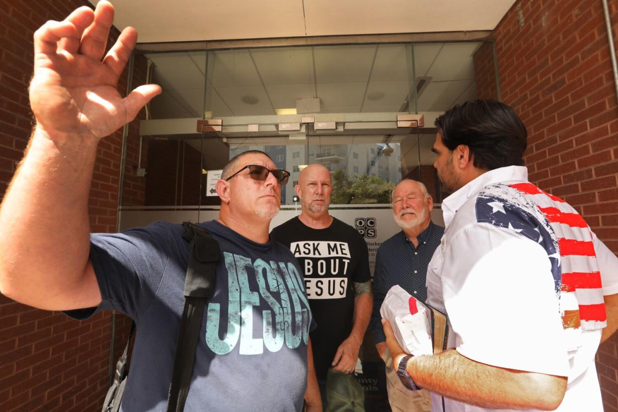 Stephen Nagy, left, Rick Johnson, second from left, and Steven Wade,