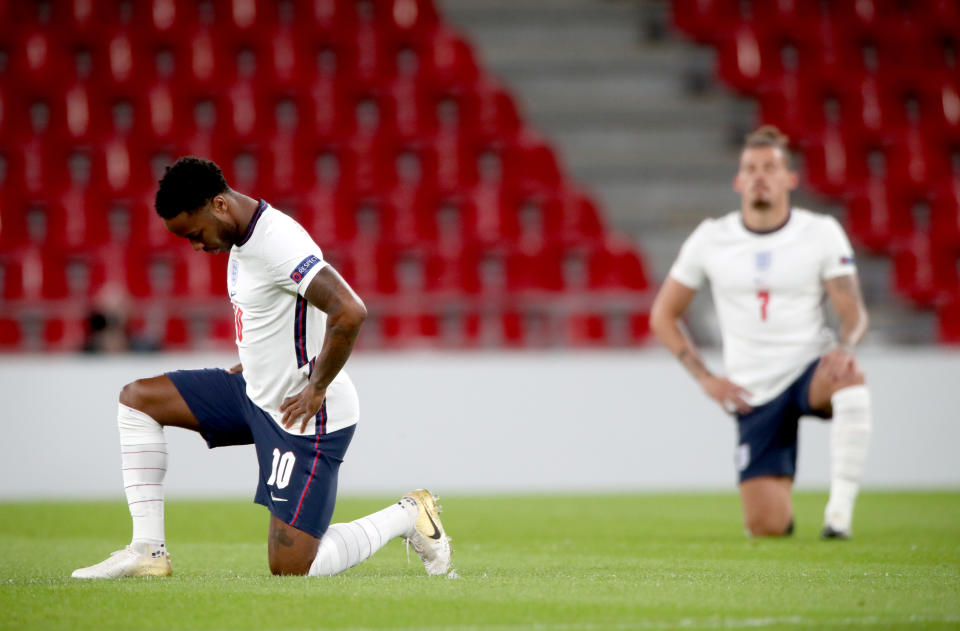 England's Raheem Sterling (left) and Kalvin Phillips take a knee in support of the Black Lives Matter movement prior to the beginning of the UEFA Nations League Group 2, League A match at Parken Stadium, Copenhagen. (Photo by Nick Potts/PA Images via Getty Images)