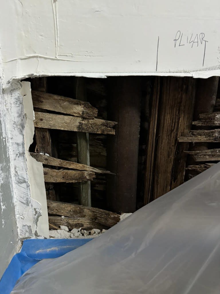 A resident named Nelly gave this photo to The Post that shows one of several holes in the kitchen wall of her first-floor apartment.