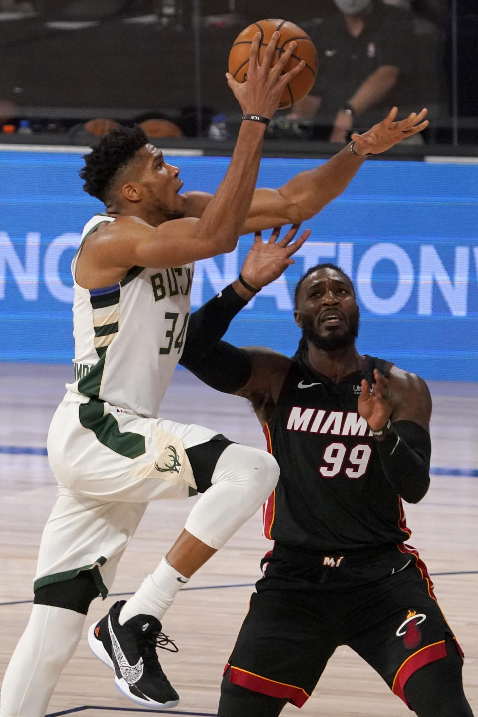 Milwaukee Bucks' Giannis Antetokounmpo (34) drives past Miami Heat's Jae Crowder (99) for a shot during the second half of an NBA basketball conference semifinal playoff game, Monday, Aug. 31, 2020, in Lake Buena Vista, Fla. (AP Photo/Mark J. Terrill)